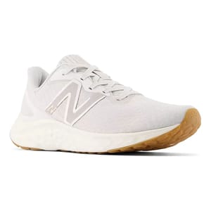 A light gray New Balance running shoe with a white midsole and gum-colored outsole, featuring the brand's logo on the side.