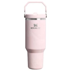 A pink Stanley tumbler with a handle, designed for portability and efficient beverage storage.