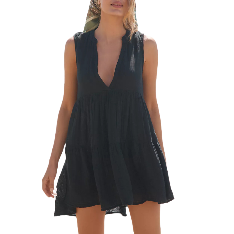 Sleeveless black dress with a deep V-neck and a tiered, loose-fitting silhouette.