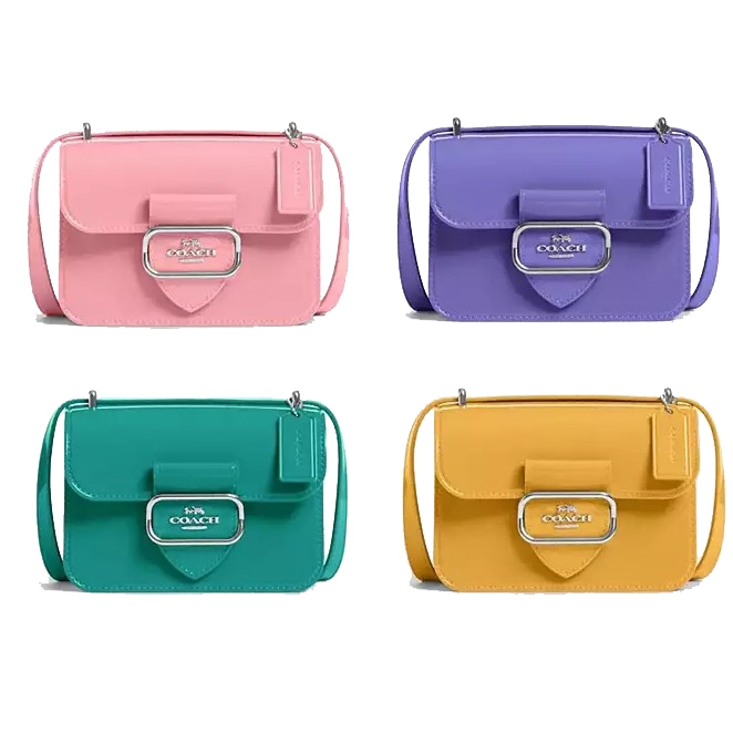 Four rectangular shoulder bags in pastel pink, purple, green, and yellow, all with front clasps and the brand logo.