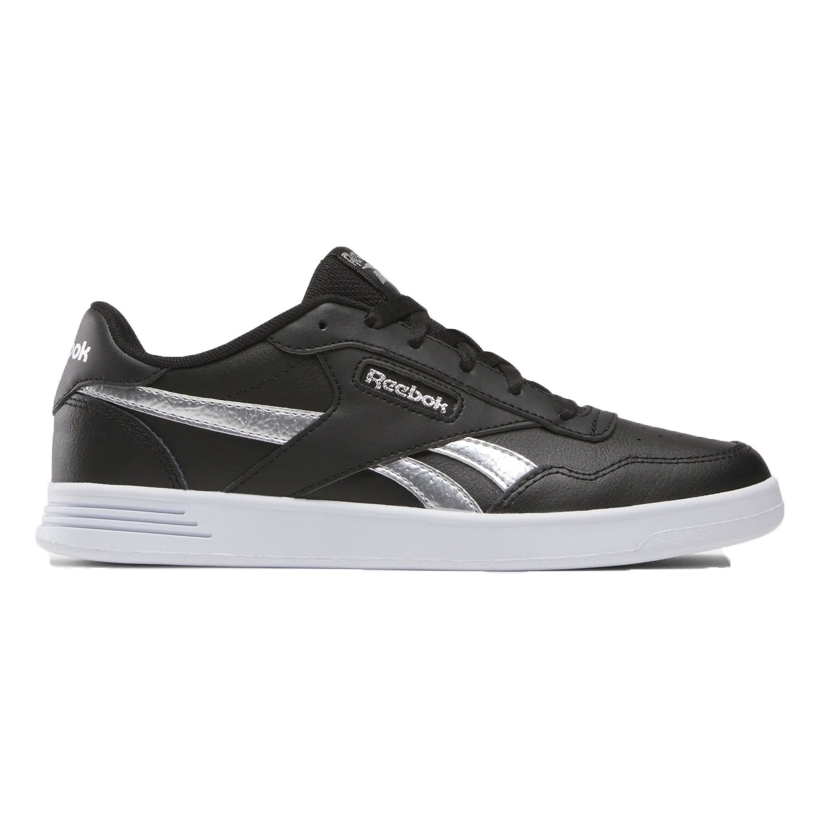 Reebok Women's Court Advance Shoes feature a sleek black design with silver accents and a white sole. They have a low-cut style with the Reebok logo on the side, providing a classic and sporty look.
