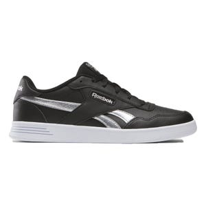 Reebok Women's Court Advance Shoes feature a sleek black design with silver accents and a white sole. They have a low-cut style with the Reebok logo on the side, providing a classic and sporty look.