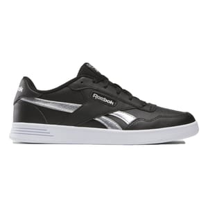 Reebok Women's Court Advance Shoes feature a sleek black design with silver accents and a white sole. They have a low-cut style with the Reebok logo on the side, providing a classic and sporty look.