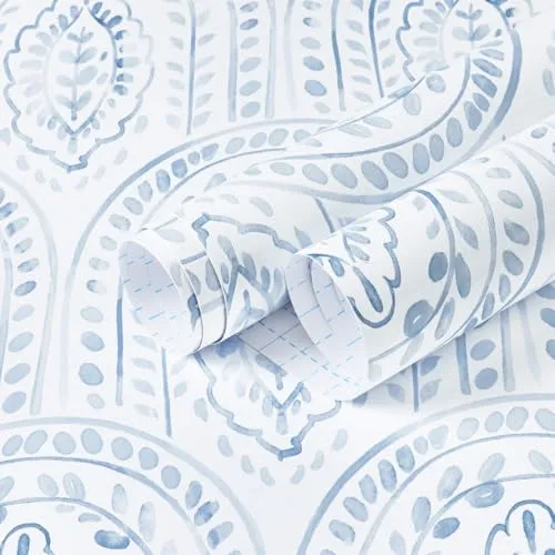Blue and white paisley-patterned wallpaper with a swirling leaf design, featuring a textured appearance.