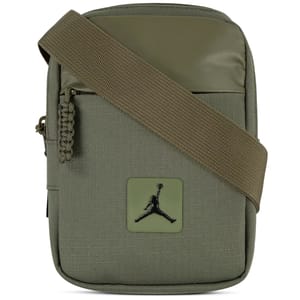 A compact green crossbody bag featuring a textured design, adjustable strap, and iconic Jumpman logo on the front.