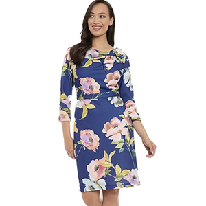Blue sheath dress with a floral pattern featuring pink, white, and yellow flowers. It has 3/4-length sleeves and a modest neckline.