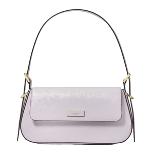 A light purple shoulder bag with gold hardware accents and a curved design. The bag features a flap closure and a structured handle.