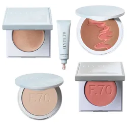 A makeup collection featuring a bronzer, a tube of foundation, a two-toned blush, a compact powder, and a pink blush from Flyte.70.