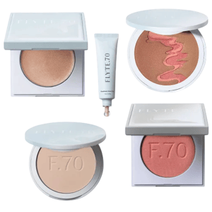 A makeup collection featuring a bronzer, a tube of foundation, a two-toned blush, a compact powder, and a pink blush from Flyte.70.