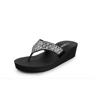 A black wedge flip-flop with a sparkly strap.