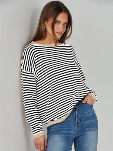 A person is wearing a black and white striped long-sleeve top paired with blue jeans.