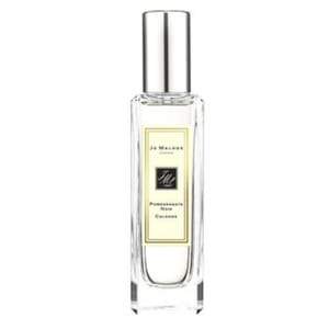 Jo Malone Pomegranate Noir Cologne features a clear, rectangular bottle with a silver cap, containing a rich, dark fragrance known for its notes of pomegranate, raspberry, and plum mixed with pink pepper and spicy woods.