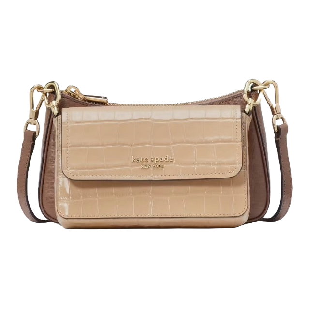 A Kate Spade New York crossbody bag in nude and brown with a crocodile pattern and gold-tone hardware, featuring a detachable strap.