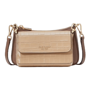 A Kate Spade New York crossbody bag in nude and brown with a crocodile pattern and gold-tone hardware, featuring a detachable strap.