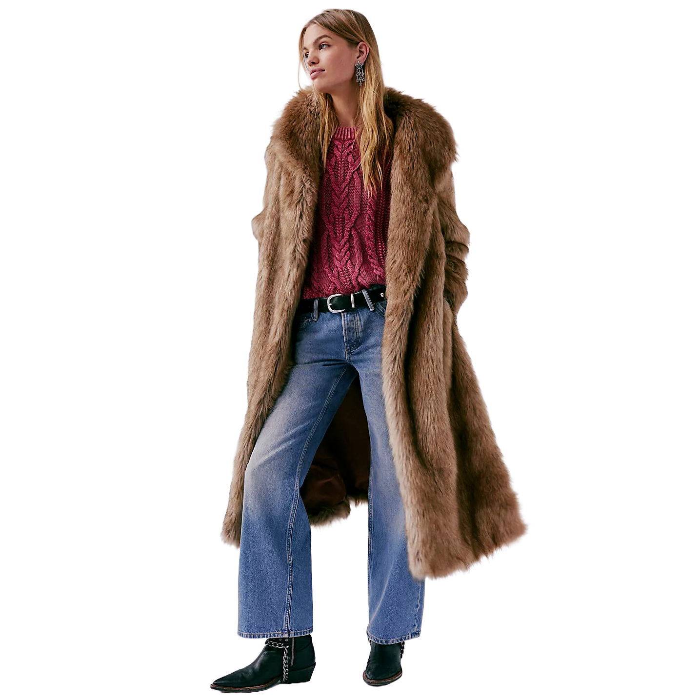 A person is wearing a long brown faux fur coat over a red cable-knit sweater, paired with blue jeans and black ankle boots.