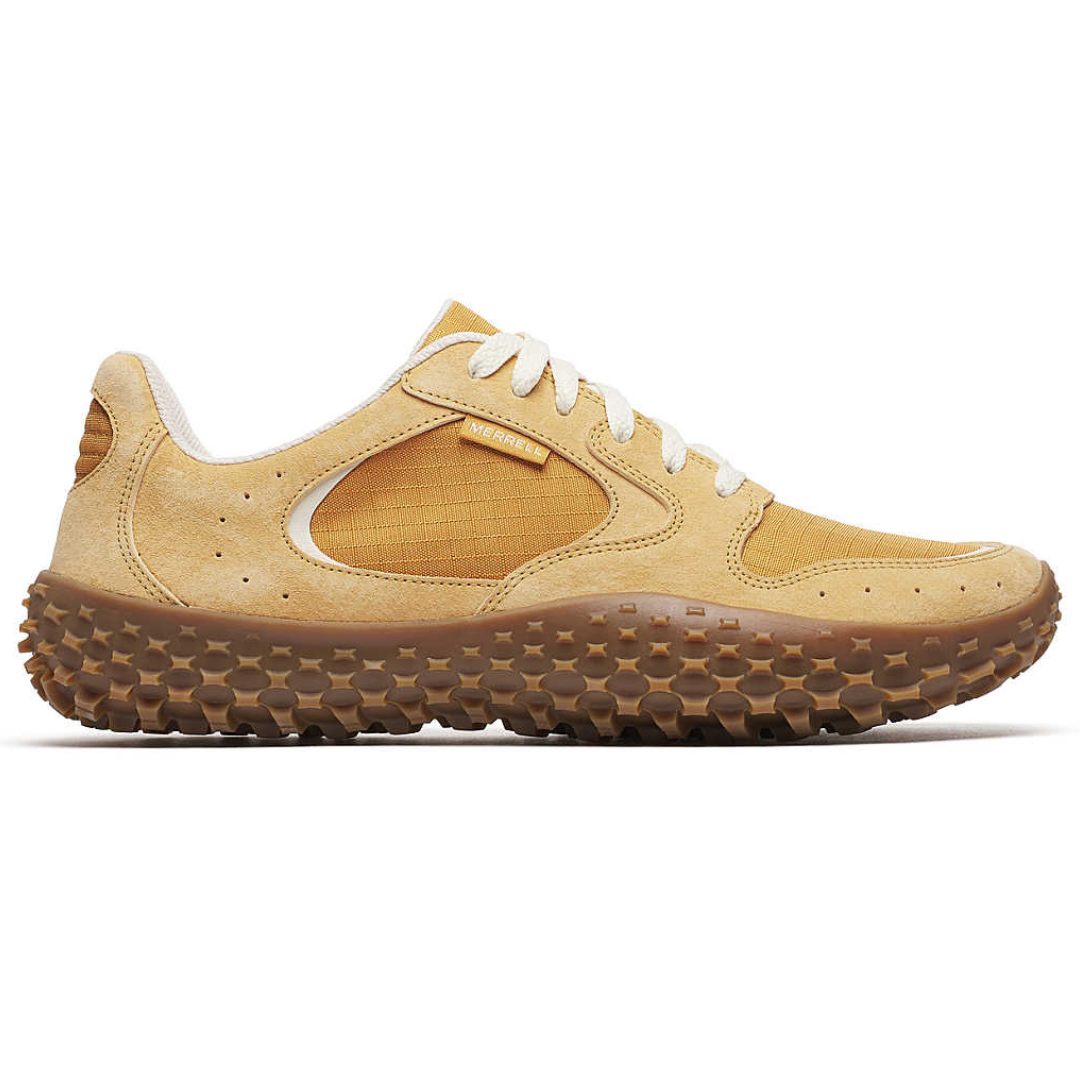 A beige Merrell sneaker featuring a rugged gum sole with textured treads, designed for outdoor activities.