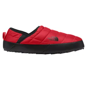 A red and black slip-on shoe from The North Face, featuring a quilted design and durable sole for comfort and insulation.