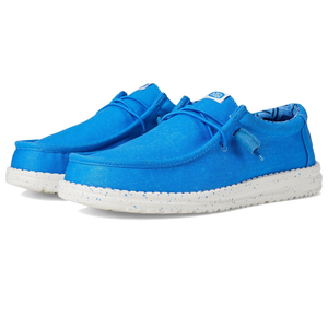 Hey Dude Wally Stretch Canvas Shoes feature a bright blue fabric upper with white speckled soles, lace-up design, and a comfortable slip-on style ideal for casual wear.