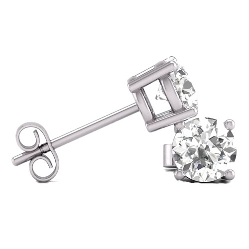 A pair of white gold stud earrings featuring round, clear gemstones in a prong setting, secured with butterfly backs.