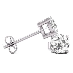 A pair of white gold stud earrings featuring round, clear gemstones in a prong setting, secured with butterfly backs.