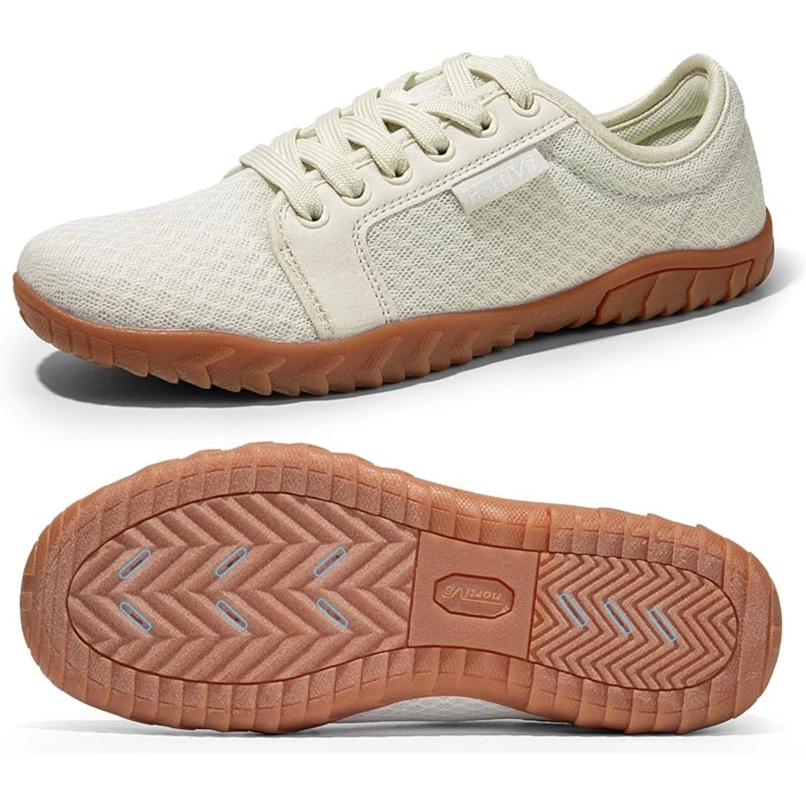 A beige lace-up casual shoe with a textured upper and a brown rubber sole, featuring a tread pattern for traction.