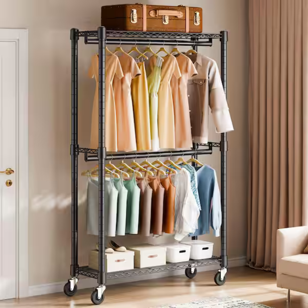 A metal garment rack with two tiers of hanging clothes and four caster wheels, featuring a variety of light-colored clothing and shelves with storage boxes.