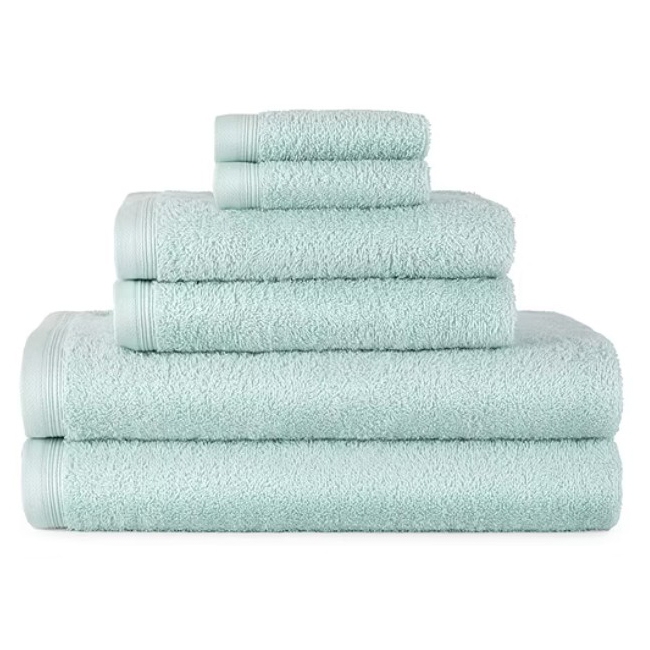 A stack of light blue towels in various sizes, with smaller towels on top and larger ones below, all featuring a textured design and bordered edges.