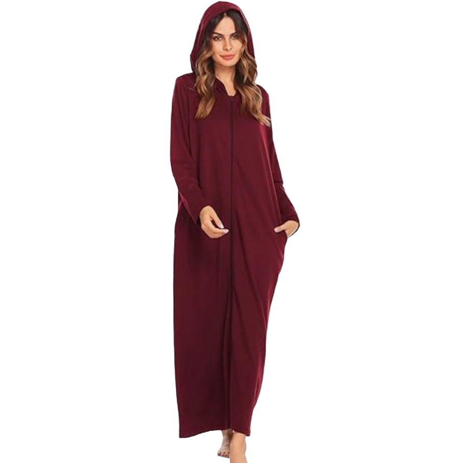 A woman wearing a long, maroon hooded cloak with pockets, ideal for cozy wear.