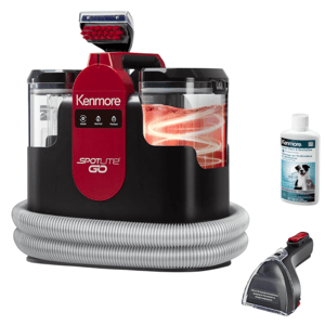 Kenmore Spotlite GO portable carpet cleaner with a coiled hose, heated cleaning modes, and a brush attachment, accompanied by a bottle of deep clean and revitalize solution for pets.