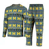 A pajama set featuring a blue and yellow Michigan Wolverines design, with repeating \“M\“ logos, snowflakes, and trees.