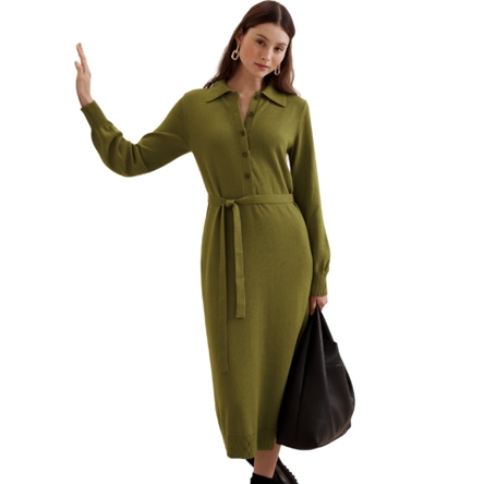 Olive green buttoned midi sweater dress with a collared neckline, long sleeves, and a waist tie, paired with black boots and a large black bag.