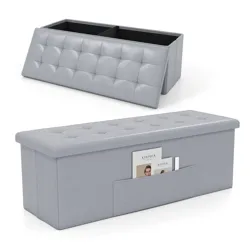 A gray tufted ottoman with storage compartments and a side magazine pocket is shown.