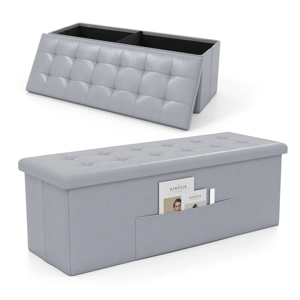 A gray tufted ottoman with storage compartments and a side magazine pocket is shown.
