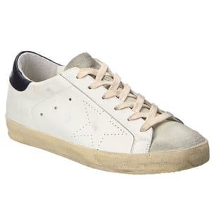 Golden Goose Leather Sneakers feature a worn-in aesthetic with a white leather upper, distressed detailing, suede toe cap, and beige laces. They have a black heel tab and a low-profile silhouette.