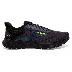 Black Brooks running shoe with a mesh upper, cushioned sole, and the brand name in yellow on the side.