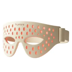 A beige LED light therapy face mask with eye cutouts and perforated design, featuring red lights for skincare purposes.