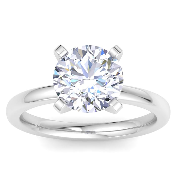 A 3-carat diamond solitaire ring set in a sleek platinum band. The round-cut diamond is held by four prongs, showcasing its brilliance and simplicity.
