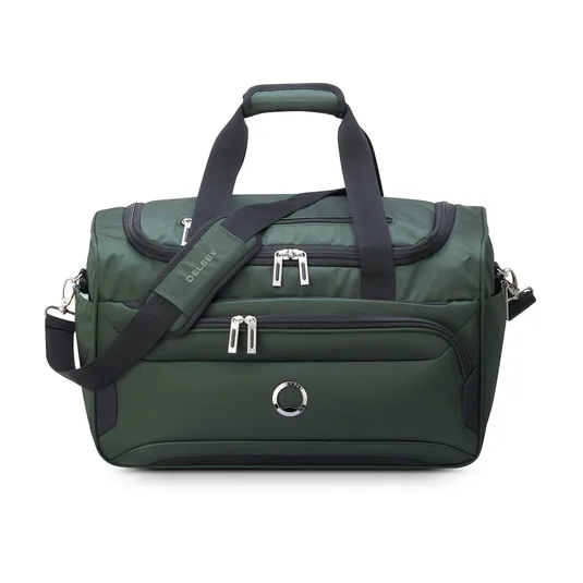 Green duffel bag with multiple zippers, a long adjustable shoulder strap, and short handles.