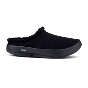 Black slip-on clog with a fuzzy lining and a rounded toe, featuring a small logo on the side.