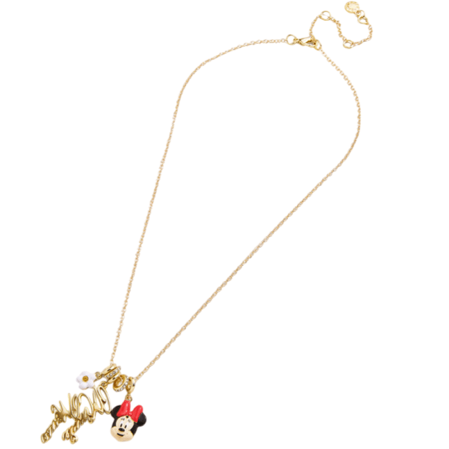 A gold-tone necklace featuring a charm with a character face and a flower adornment next to a pendant spelling out \“Minnie.\“