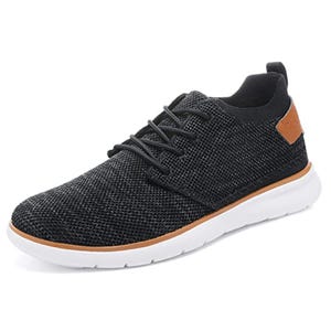 A black mesh casual sneaker with white sole and brown accent near the heel, featuring a lace-up design.