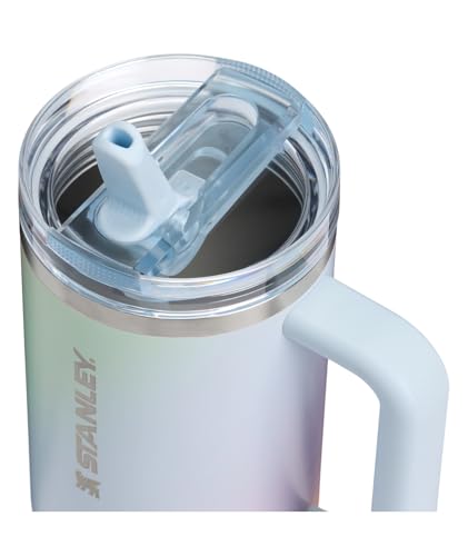 A stainless steel tumbler with a handle, featuring a clear lid with a straw opening, branded with \“Stanley.\“