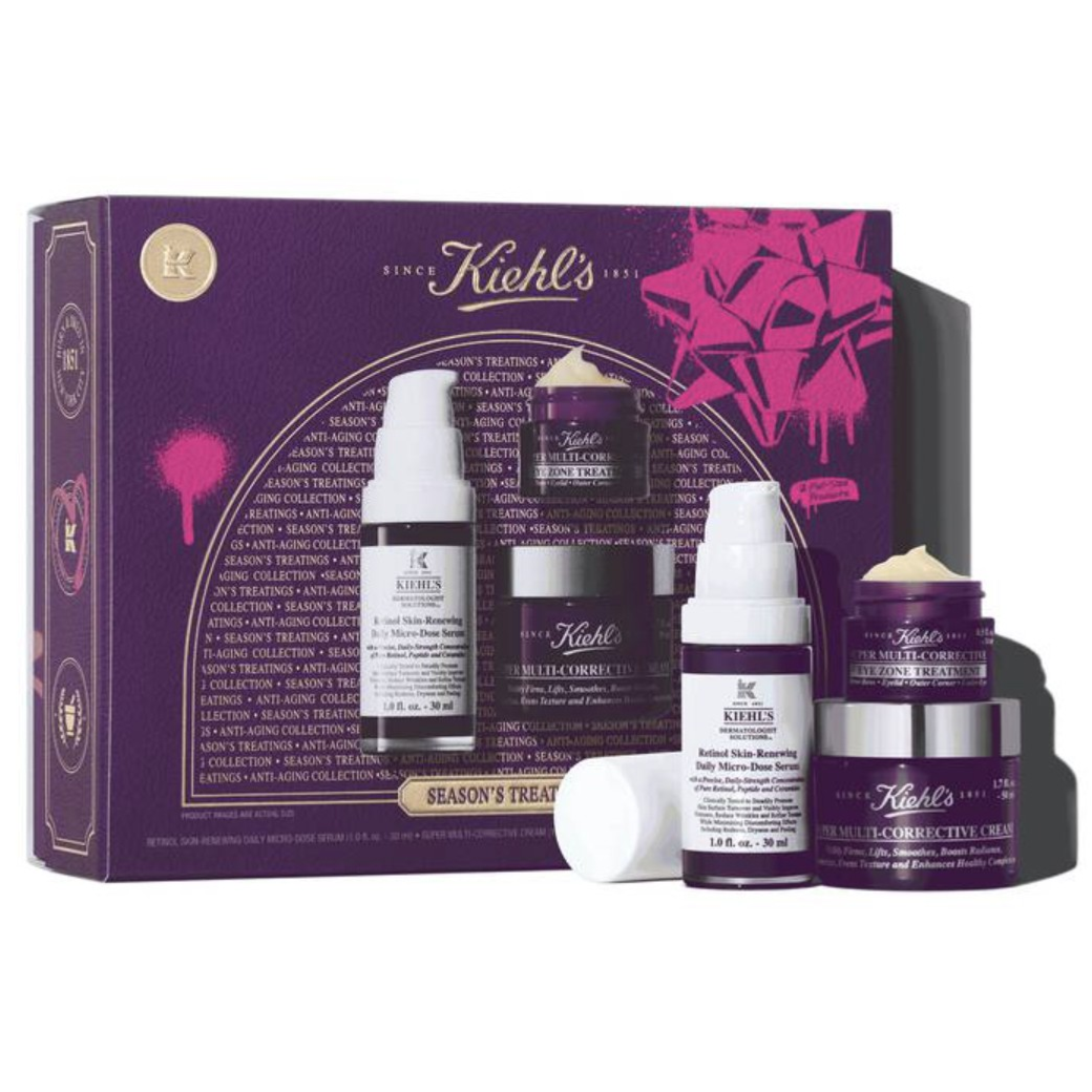 Kiehl's skincare set featuring Retinol Skin-Renewing Daily Micro-Dose Serum, Super Multi-Corrective Cream, and Eye Zone Treatment, packaged in a purple and pink box.