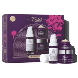 Kiehl's skincare set featuring Retinol Skin-Renewing Daily Micro-Dose Serum, Super Multi-Corrective Cream, and Eye Zone Treatment, packaged in a purple and pink box.