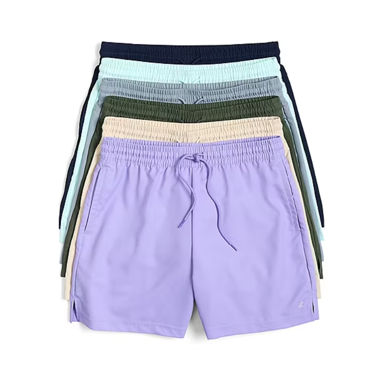 A stack of elastic-waisted drawstring shorts in various colors, including lavender, beige, green, and blue.