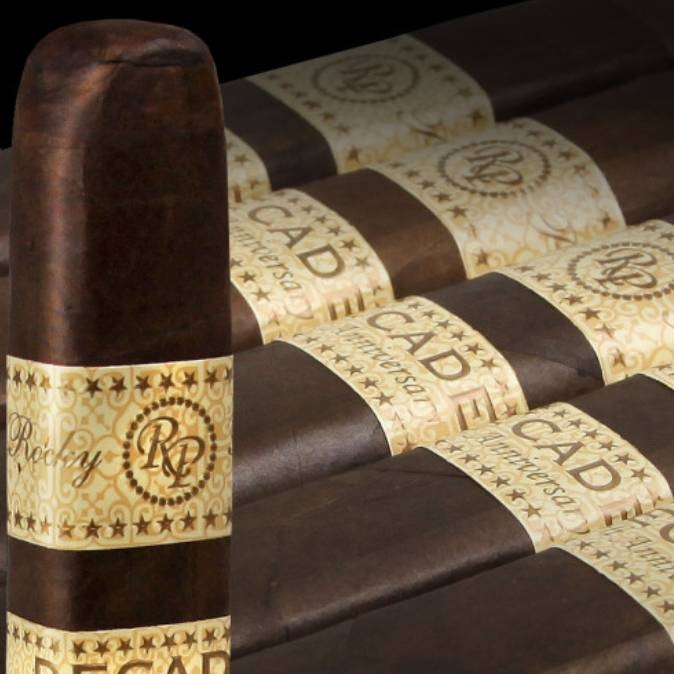 A collection of cigars with decorative golden bands labeled \“Rocky.\“