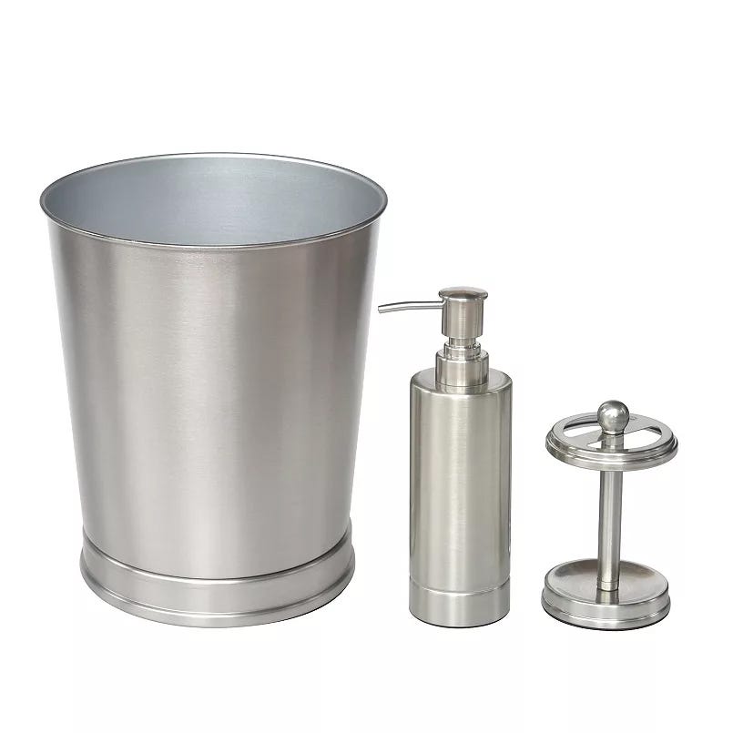 A stainless steel bathroom set includes a waste bin, a soap dispenser, and a toilet paper holder, all featuring a sleek, brushed metal finish.