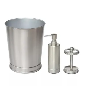 A stainless steel bathroom set includes a waste bin, a soap dispenser, and a toilet paper holder, all featuring a sleek, brushed metal finish.
