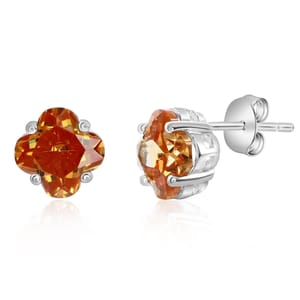 Silver stud earrings with clover-shaped orange gemstones, set in a secure prong setting.