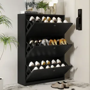 Black shoe cabinet with three pull-out drawers holding various pairs of shoes. It's placed in a room with plants and a digital lock on the wall.